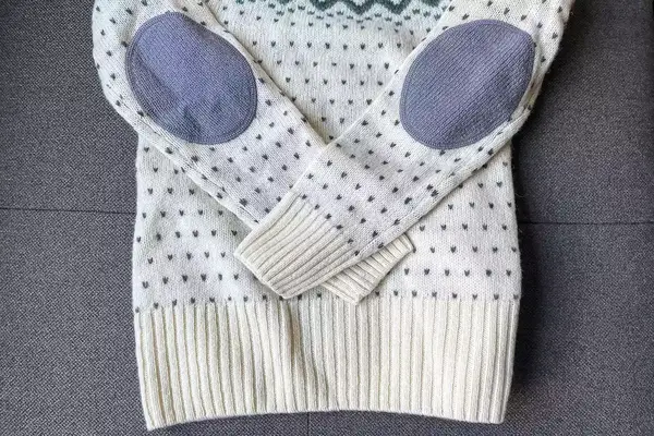 Fjallraven Ovik Knit Sweater on a grey surface