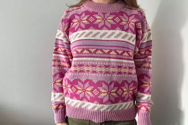 A person wearing the Dale of Norway Ingrid Sweater
