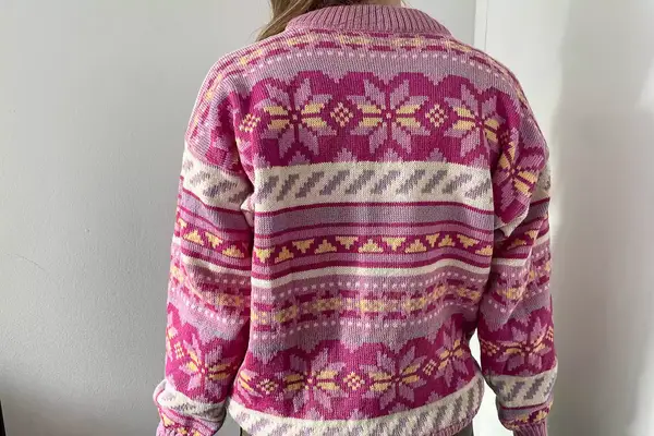A person wearing the Dale of Norway Ingrid Sweater