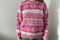 A person wearing the Dale of Norway Ingrid Sweater