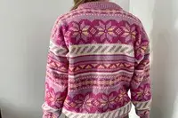A person wearing the Dale of Norway Ingrid Sweater