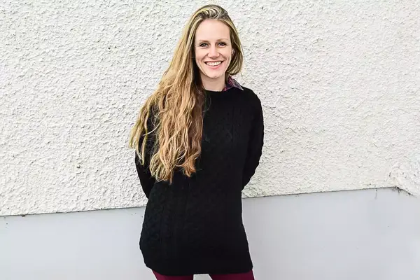 A person wearing the Aran Sweater Market Men