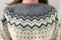 A closeup of a person wearing the Fjallraven Ovik Knit Sweater
