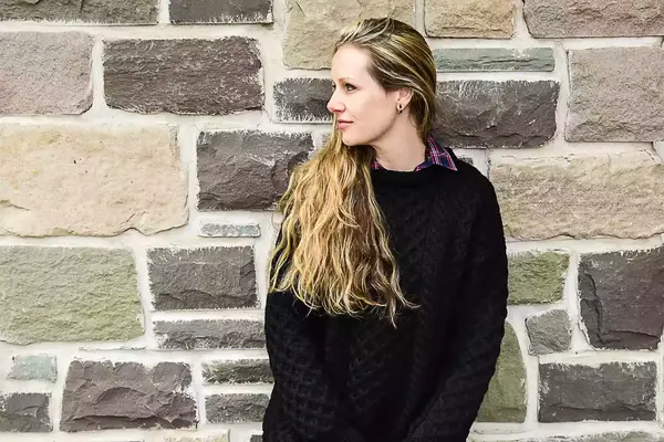 A person wearing the Aran Sweater Market Men