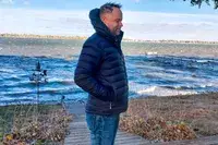 A side view of a person wearing the Stio Men