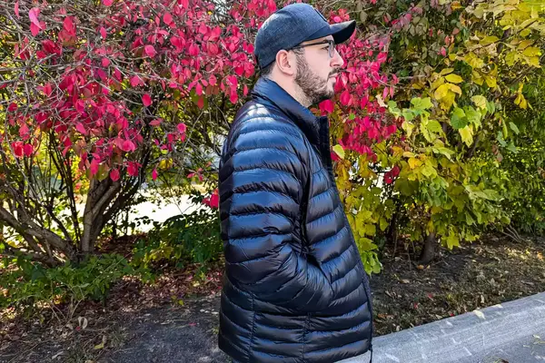 A side view of a person wearing The North Face Men’s Summit Series Breithorn Jacket