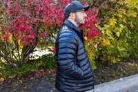 A side view of a person wearing The North Face Men’s Summit Series Breithorn Jacket