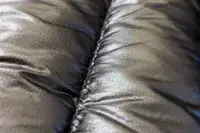 The stitching on the seam of the North Face Men’s Summit Series Breithorn Jacket