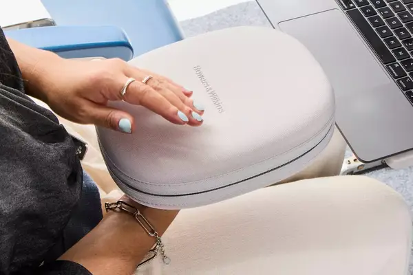 A person holding the Bowers & Wilkins Px7 S2e carying case