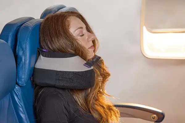 A person resting on the Cabeau The Neck