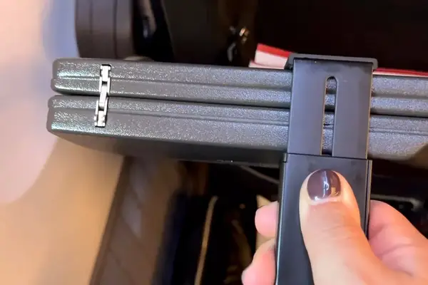 a person placing the Perilogics Universal In-flight Plane Holder Mount