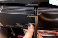 a person placing the Perilogics Universal In-flight Plane Holder Mount on a plane