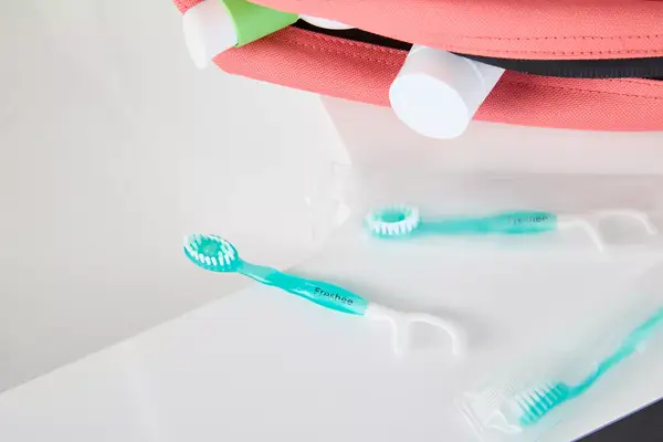 The Freshee 5-in-1 Disposable Mini Toothbrush on a bathroom counter