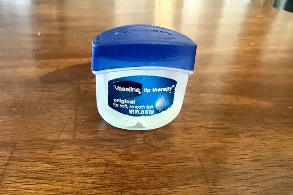 The Vaseline Lip Therapy Original Mini container on a table
