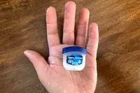 The Vaseline Lip Therapy Original Mini container in someone
