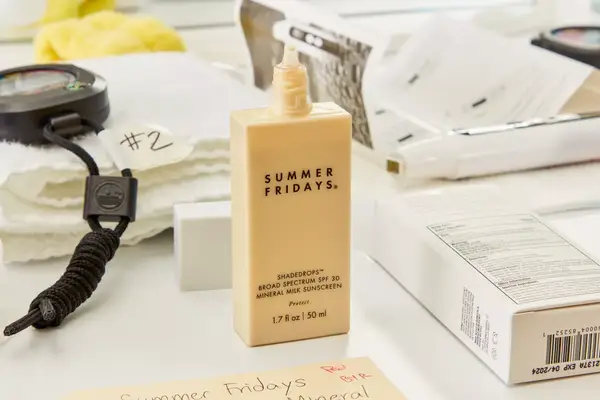 A person adjusting the Cabeau The Neck