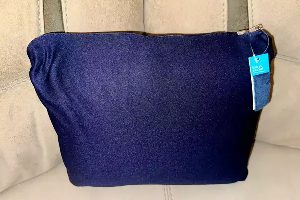 Travelrest 4-in-1 Travel Blanket carrying pouch displayed on a gray surface