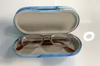 A pair of glasses in the Zettokete 2-in-1 Contact Lens and Glasses Case