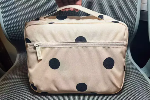 Person Holding Calpak Tablet Tech Organizer 