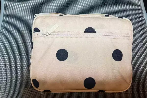 Calpak Tablet Tech Organizer On Grey Seat