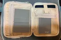 Calpak Tablet Tech Organizer Open And Displaying Personal Items