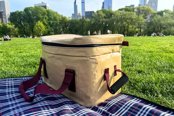 The Snow Peak Soft Cooler 38 on a picnic basket