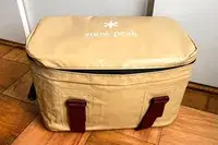 The Snow Peak Soft Cooler 38 on a wooden floor