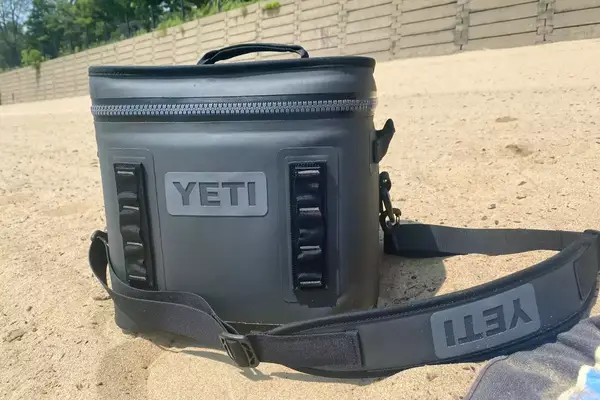 A Yeti Hopper Flip 12 Soft Cooler sitting on the beach