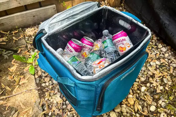 Drinks and ice inside the Coleman Chiller 42-Can Soft-Sided Portable Cooler with Wheels