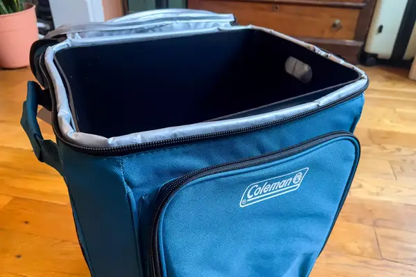 The brand name and logo on the front of the Coleman Chiller 42-Can Soft-Sided Portable Cooler with Wheels