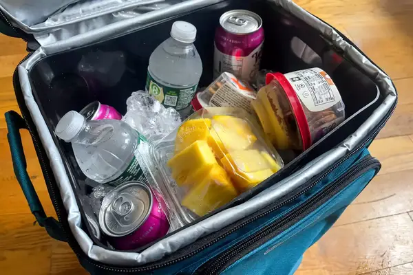 Drinks and snacks inside the Coleman Chiller 42-Can Soft-Sided Portable Cooler with Wheels