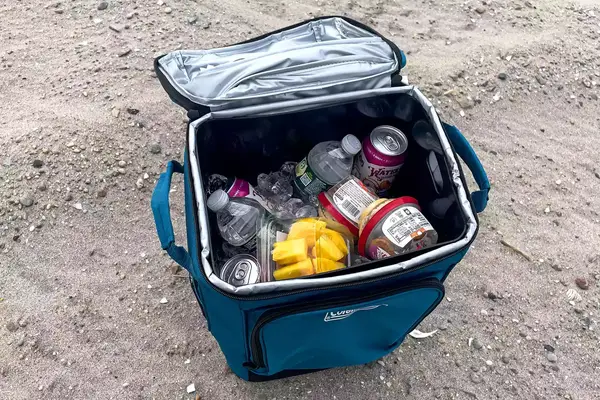 Drinks and ice in the Coleman Chiller 42-Can Soft-Sided Portable Cooler with Wheels