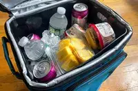 Drinks and snacks inside the Coleman Chiller 42-Can Soft-Sided Portable Cooler with Wheels