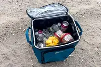 Drinks and ice in the Coleman Chiller 42-Can Soft-Sided Portable Cooler with Wheels