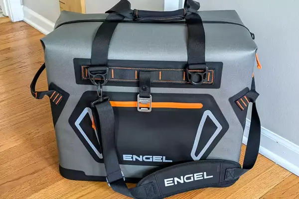 The Engel HD30 Heavy-Duty Soft-Sided Cooler Bag on a wooden floor