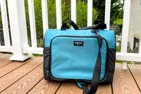 The Igloo Latitude Snapdown 36-Can Cooler Bag on a porch