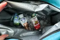 Drinks and ice inside the Igloo Latitude Snapdown 36-Can Cooler Bag