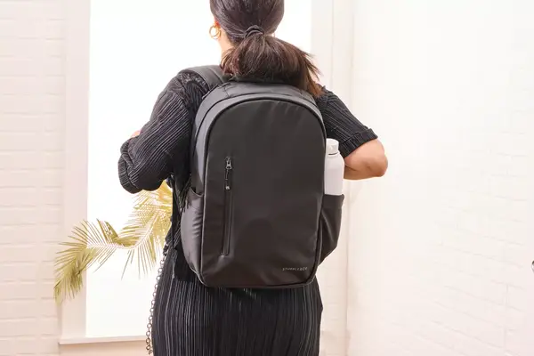 Phone and water bottle in the main compartment of the Cheruty Women