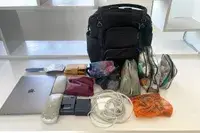 The items that fit inside the Baggallini Nolita Convertible Backpack