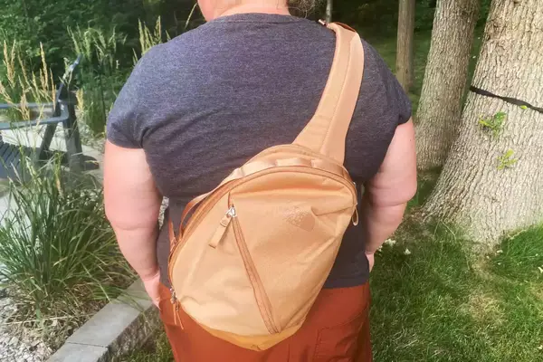 Person standing outdoors while wearing The North Face Women’s Isabella Sling on their back