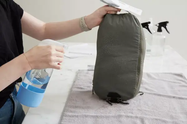 An overhead view of a filled Patagonia Black Hole Cube, Large 14L on a white surface