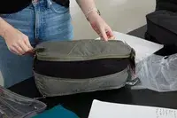 The Patagonia Black Hole Cube, Large 14L on a white surface