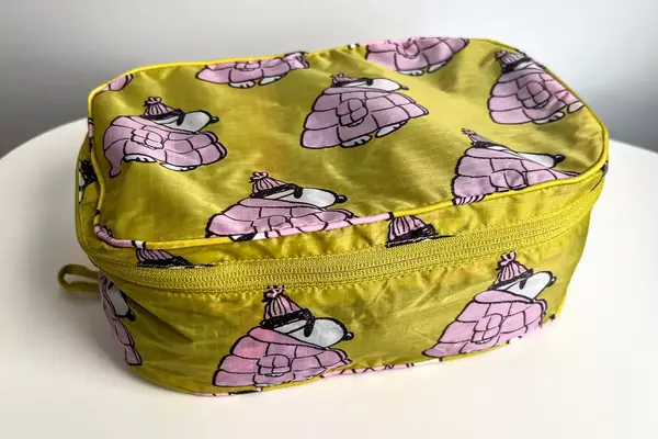 A closed piece of the Baggu Packing Cube Set on a white table