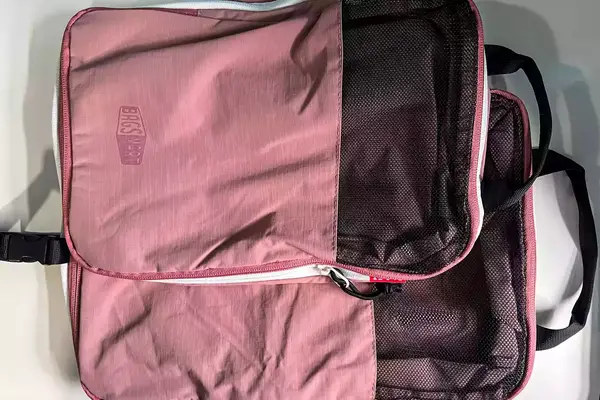 Two parts of the Blast 6PCS Compression Travel Packing Cubes stacked on a white surface