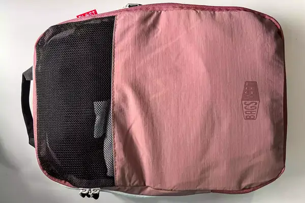 A closed cube from the Blast 6PCS Compression Travel Packing Cubes on a white surface