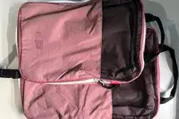 Two parts of the Blast 6PCS Compression Travel Packing Cubes stacked on a white surface