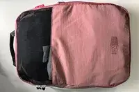 A closed cube from the Blast 6PCS Compression Travel Packing Cubes on a white surface