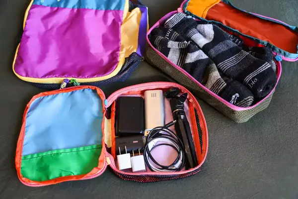 Two opened filled Cotopaxi Cubos Packing Cubes