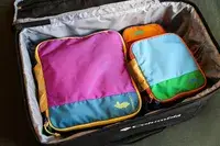 The Cotopaxi Cubos Packing Cubes packed in a bag