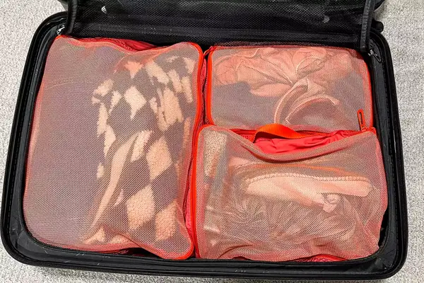 The Cram Packing Cubes packed in a suitcase